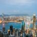 Explore the breathtaking skyline of Hong Kong at dusk, highlighting vibrant lights and Victoria Harbor.